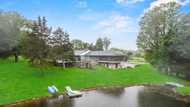736 State Route 94 N, Warwick, NY 10990 - rear view of property with stone siding, a water view, a lawn, and a chimney