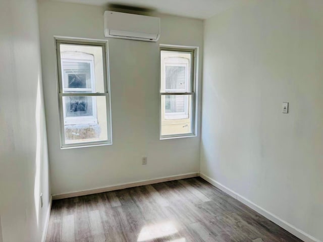 1372 E 94th St, Brooklyn, NY 11236 - unfurnished room featuring an AC wall unit, wood finished floors, baseboards, and attic access