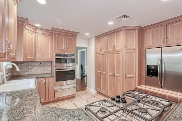 285 Willow Grove Rd, Stony Point, NY 10980 - kitchen with a warming drawer, stainless steel appliances, a sink, light tile patterned flooring, and recessed lighting