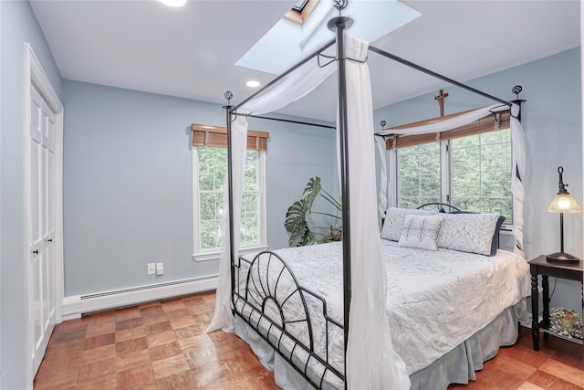 285 Willow Grove Rd, Stony Point, NY 10980 - bedroom featuring a baseboard heating unit, a skylight, recessed lighting, and baseboards