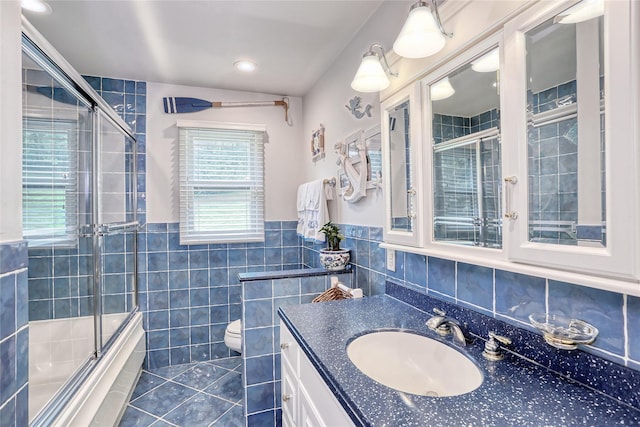 285 Willow Grove Rd, Stony Point, NY 10980 - bathroom featuring tile walls, tile patterned flooring, vanity, toilet, and shower / bath combination with glass door
