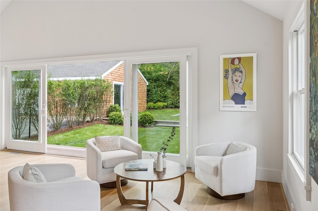 69 Bay View Dr W, Sag Harbor, NY 11963 - sitting room featuring healthy amount of natural light, vaulted ceiling, wood finished floors, and baseboards