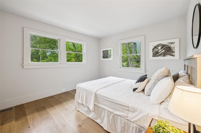 69 Bay View Dr W, Sag Harbor, NY 11963 - bedroom with light wood-type flooring and baseboards