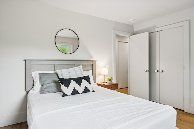 69 Bay View Dr W, Sag Harbor, NY 11963 - bedroom with a closet and wood finished floors