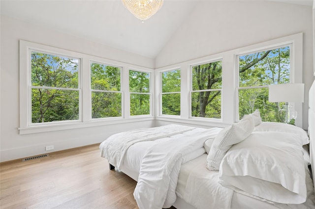 69 Bay View Dr W, Sag Harbor, NY 11963 - bedroom with lofted ceiling and wood finished floors