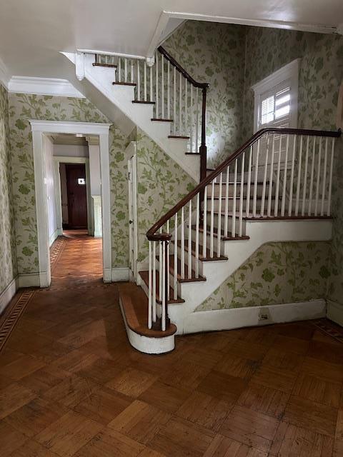 689 E 19th St, Brooklyn, NY 11230 - stairway with wallpapered walls, ornamental molding, and baseboards