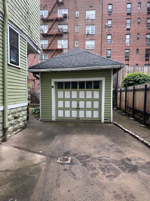 689 E 19th St, Brooklyn, NY 11230 - detached garage featuring driveway