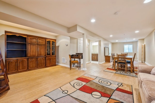 174 Spring Dr Unit 174, East Meadow, NY 11554 - living room with light wood finished floors, baseboards, and recessed lighting
