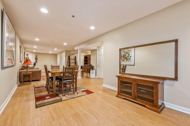 174 Spring Dr Unit 174, East Meadow, NY 11554 - dining area featuring light wood-type flooring, recessed lighting, and baseboards