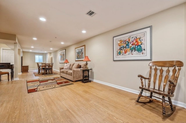 174 Spring Dr Unit 174, East Meadow, NY 11554 - living area featuring recessed lighting, wood finished floors, and baseboards