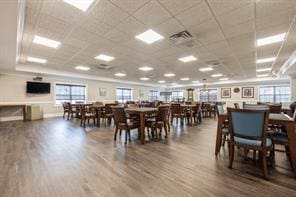 174 Spring Dr Unit 174, East Meadow, NY 11554 - dining space with wood finished floors and a drop ceiling