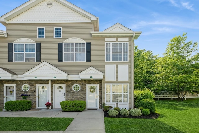 174 Spring Dr Unit 174, East Meadow, NY 11554 - multi unit property featuring a front yard and stone siding