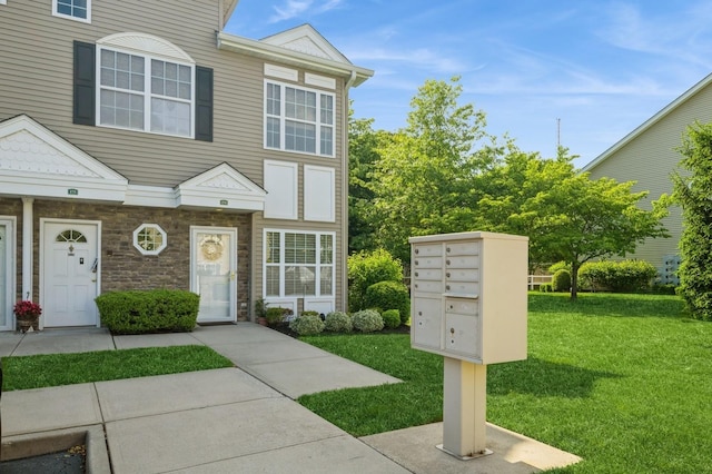 174 Spring Dr Unit 174, East Meadow, NY 11554 - multi unit property featuring a front lawn and stone siding