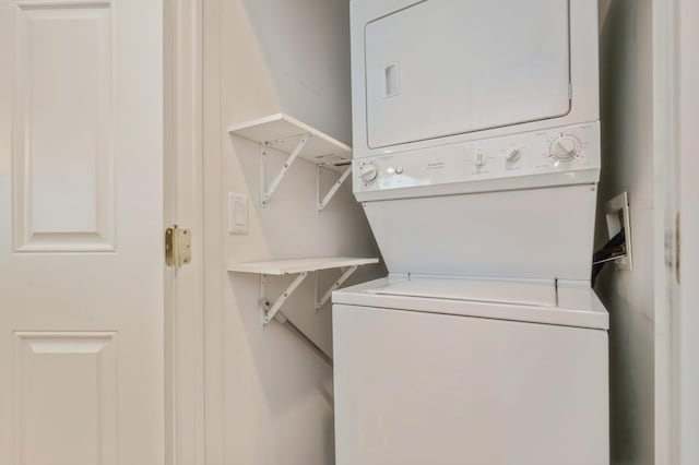 174 Spring Dr Unit 174, East Meadow, NY 11554 - laundry area featuring stacked washer / dryer