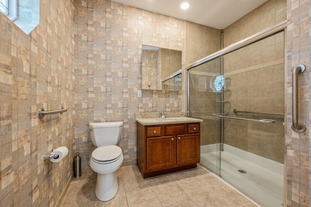 174 Spring Dr Unit 174, East Meadow, NY 11554 - full bath with tile walls, toilet, vanity, a shower stall, and tile patterned floors