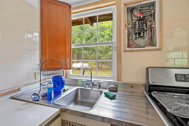 11 Waldweg Dr, Sparrowbush, NY 12780 - kitchen featuring healthy amount of natural light, stove, electric panel, and tasteful backsplash