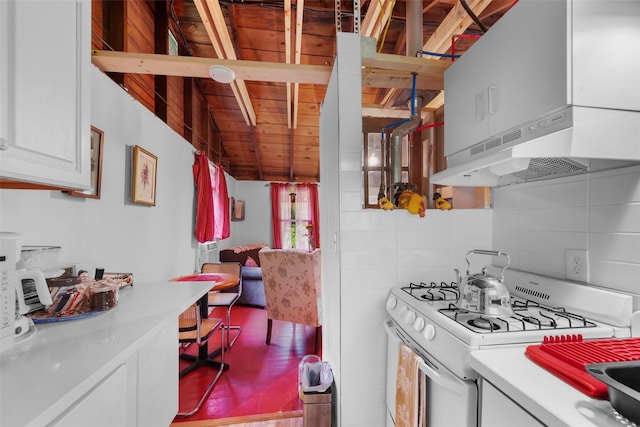 11 Waldweg Dr, Sparrowbush, NY 12780 - kitchen featuring white range with gas cooktop, light countertops, white cabinetry, decorative backsplash, and wood ceiling