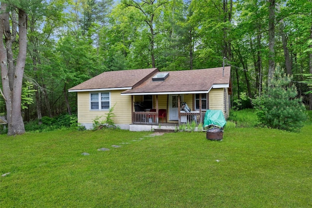 11 Waldweg Dr, Sparrowbush, NY 12780 - view of front of home featuring covered porch, a front lawn, and a shingled roof