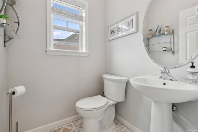 55 Hamptons Court Dr E Unit 55, Eastport, NY 11941 - bathroom featuring toilet and baseboards
