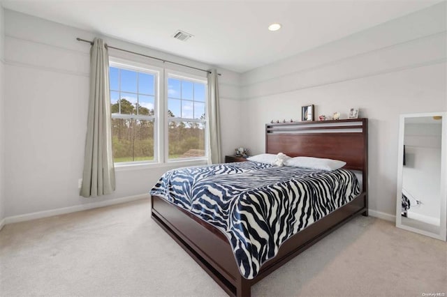 55 Hamptons Court Dr E Unit 55, Eastport, NY 11941 - carpeted bedroom with baseboards and recessed lighting