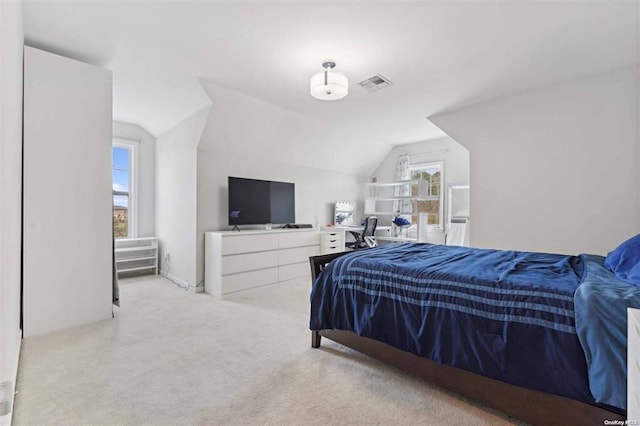 55 Hamptons Court Dr E Unit 55, Eastport, NY 11941 - bedroom with lofted ceiling and carpet flooring