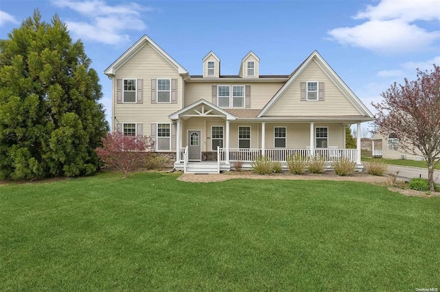 55 Hamptons Court Dr E Unit 55, Eastport, NY 11941 - view of front of home featuring a porch and a front yard
