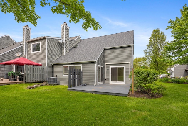19 Cushing Grn S, Pawling, NY 12564 - back of house with a wooden deck, a yard, a shingled roof, and central AC unit