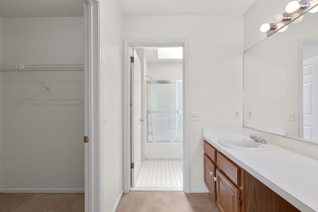 19 Cushing Grn S, Pawling, NY 12564 - bathroom with vanity, a spacious closet, and baseboards