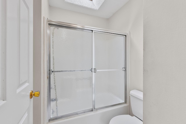 19 Cushing Grn S, Pawling, NY 12564 - bathroom featuring toilet, a skylight, and enclosed tub / shower combo