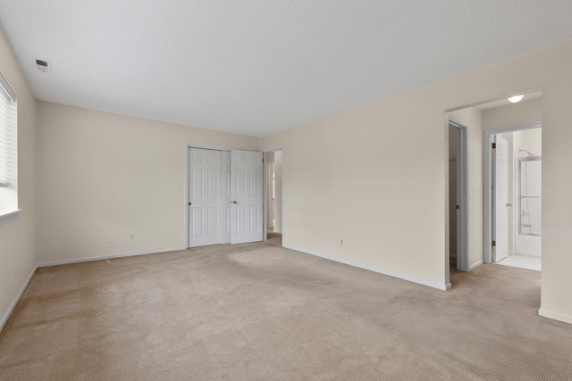 19 Cushing Grn S, Pawling, NY 12564 - unfurnished bedroom with carpet flooring, baseboards, a closet, and ensuite bath
