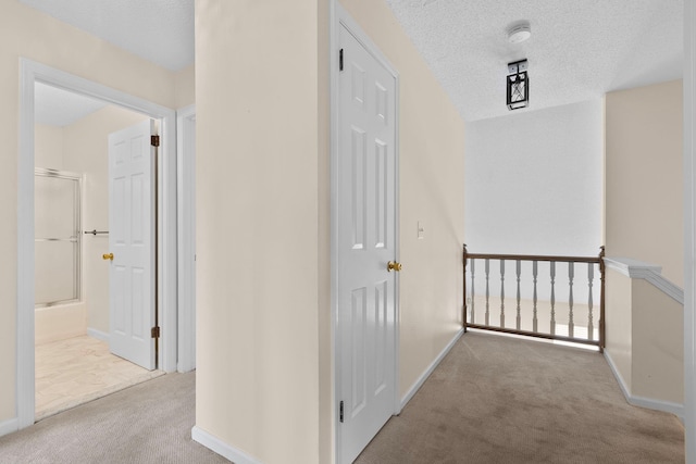 19 Cushing Grn S, Pawling, NY 12564 - corridor featuring carpet, baseboards, and a textured ceiling