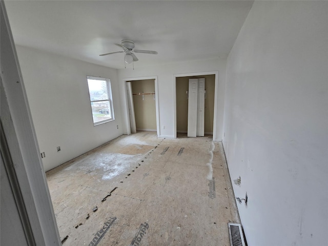 27 Thompson St, Port Jervis, NY 12771 - unfurnished bedroom featuring multiple closets and ceiling fan
