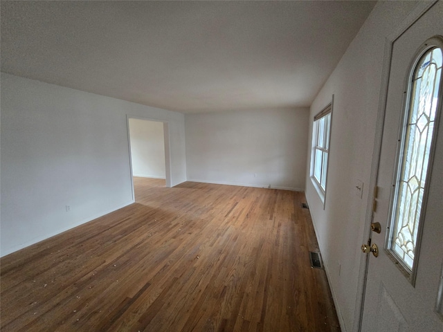 27 Thompson St, Port Jervis, NY 12771 - empty room with wood finished floors and baseboards