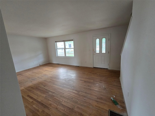 27 Thompson St, Port Jervis, NY 12771 - entrance foyer with hardwood / wood-style flooring and baseboards