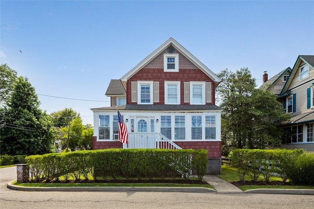 28 Shore Rd, Babylon, NY 11702 - view of front of property featuring roof with shingles