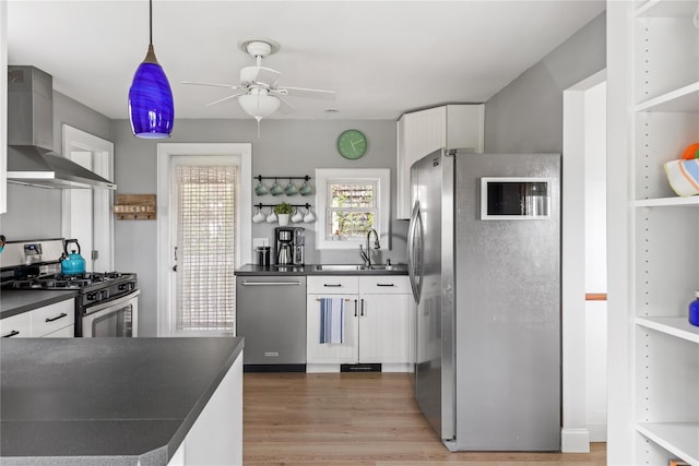 28 Shore Rd, Babylon, NY 11702 - kitchen with wall chimney range hood, appliances with stainless steel finishes, and dark countertops