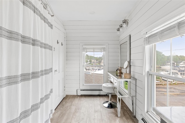 28 Shore Rd, Babylon, NY 11702 - sunroom / solarium featuring baseboard heating
