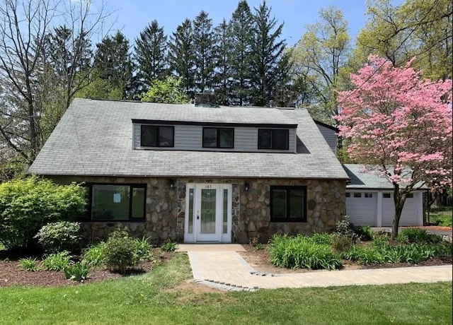 167 Grandview Ave, Nanuet, NY 10954 - view of front of house featuring stone siding, a garage, and a front lawn
