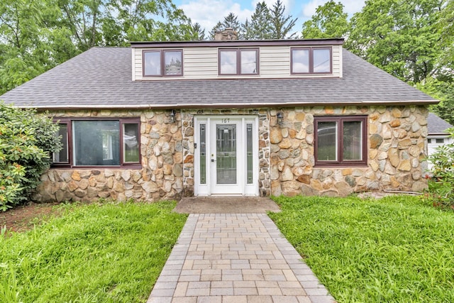 167 Grandview Ave, Nanuet, NY 10954 - view of front of home featuring stone siding, a shingled roof, a chimney, and a front lawn