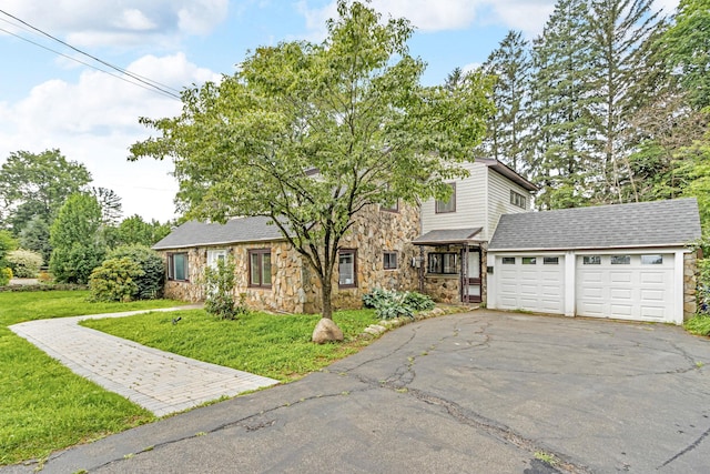 167 Grandview Ave, Nanuet, NY 10954 - view of front of home with stone siding, asphalt driveway, a front yard, and a garage