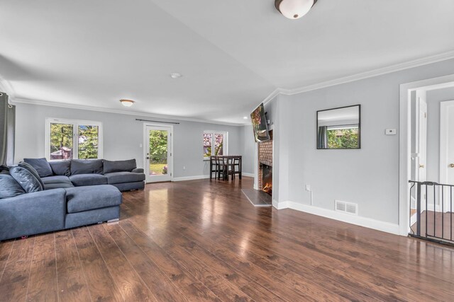 167 Grandview Ave, Nanuet, NY 10954 - living area with ornamental molding, wood finished floors, and a fireplace