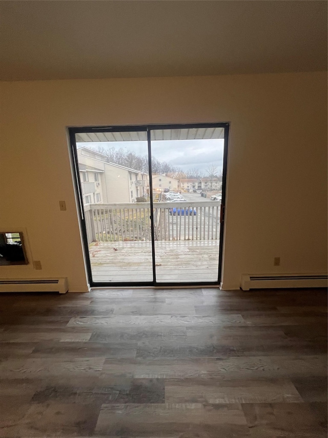 228 Concord Ln, Middletown, NY 10940 - unfurnished room with a baseboard heating unit and wood finished floors