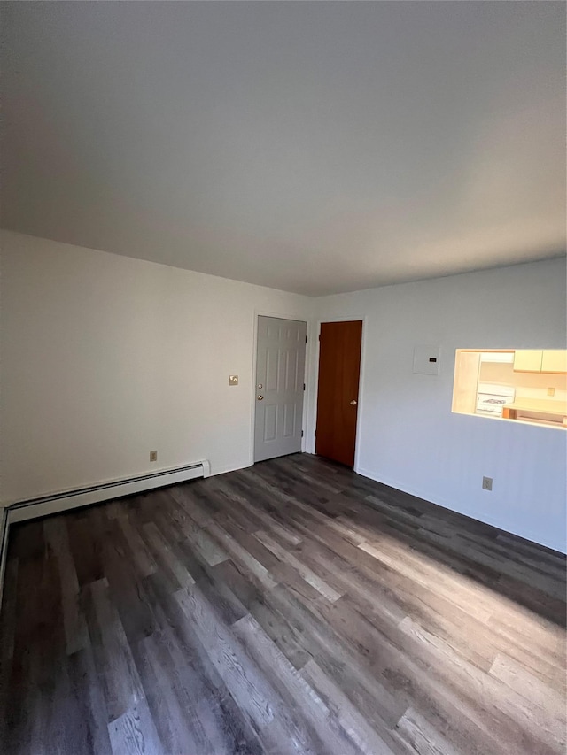 228 Concord Ln, Middletown, NY 10940 - empty room with dark wood-style flooring and a baseboard radiator
