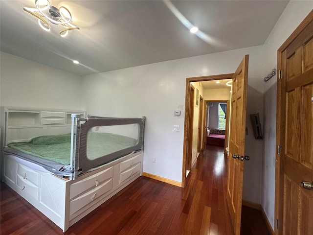 313 88th St, Brooklyn, NY 11209 - bedroom with dark wood finished floors and baseboards