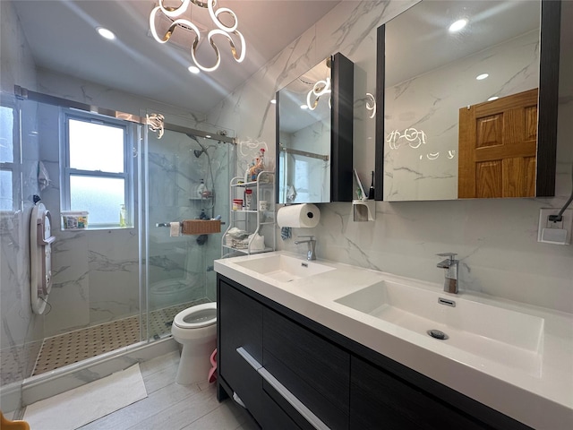 313 88th St, Brooklyn, NY 11209 - bathroom with toilet, a marble finish shower, double vanity, recessed lighting, and a chandelier