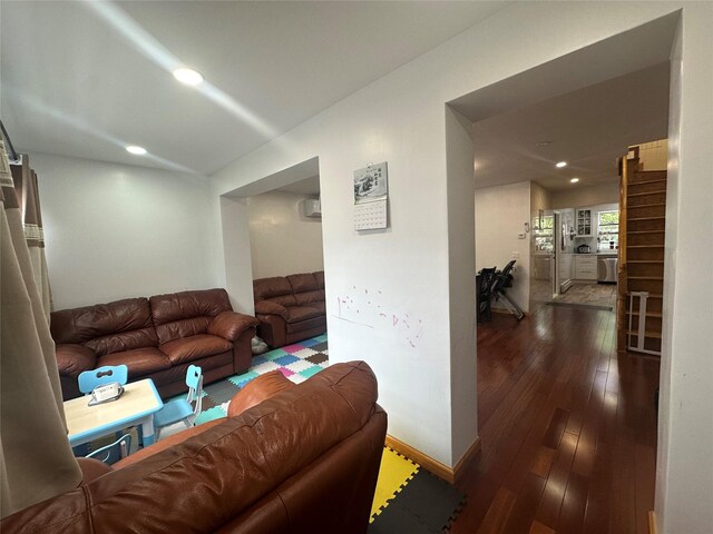 313 88th St, Brooklyn, NY 11209 - living area featuring dark wood-style flooring, recessed lighting, and baseboards