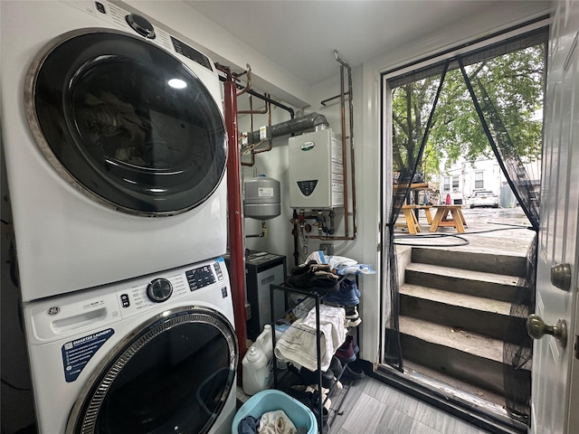 313 88th St, Brooklyn, NY 11209 - laundry area featuring stacked washer / drying machine and tankless water heater
