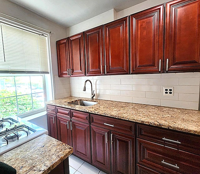 5607 31st Ave Unit 1B, Woodside, NY 11377 - kitchen with a sink, dark brown cabinets, light stone counters, and tasteful backsplash