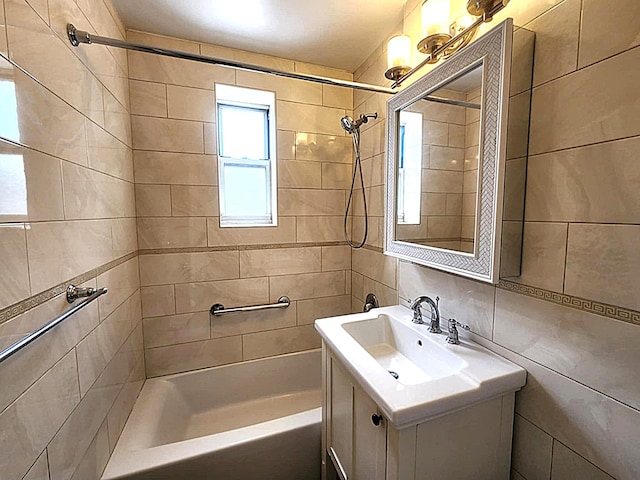 5607 31st Ave Unit 1B, Woodside, NY 11377 - bathroom featuring shower / tub combination, vanity, and tile walls