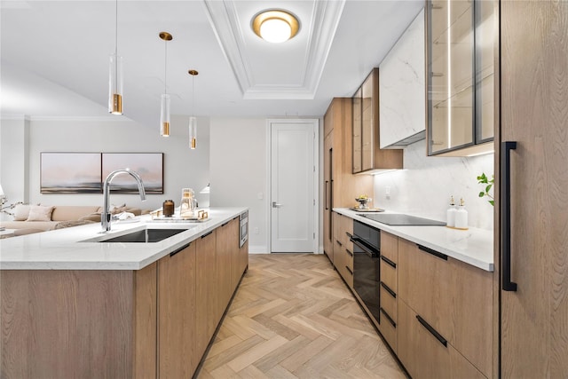 78-29 Austin St Unit Th1, Forest Hills, NY 11375 - kitchen with a sink, black appliances, modern cabinets, light stone countertops, and hanging light fixtures